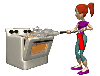 woman using fire extinguisher on oven